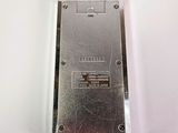 a silver cell phone sitting on top of a white table