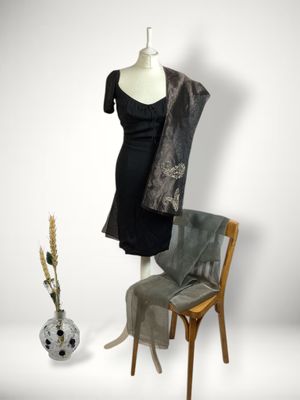 an image of a mannequin and a dress on a mannequin stand