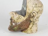 a ceramic sculpture of a man ' s head with a beard