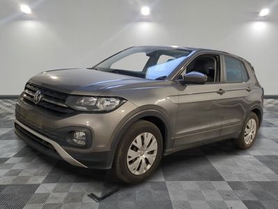 a gray volkswagen suv parked in a room with a checkered floor