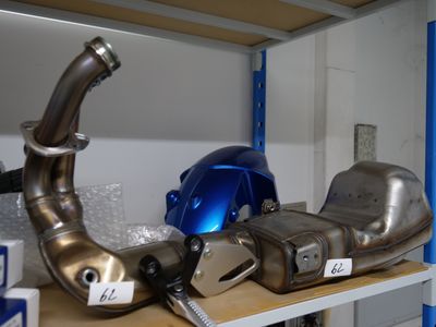 many different types of exhaust pipes on a shelf