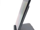 a cell phone that is sitting on top of a stand