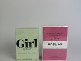 two boxes of perfume sitting next to each other on a white surface
