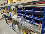 many bins and containers on the shelves in the room