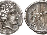une pièce d'argent sur laquelle figure une tête de femme