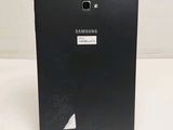 the back of a black samsung tablet with a sticker on it