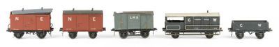 five toy trains that are lined up in a row