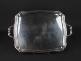 a silver tray with handles and handles on a black background