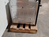 an image of a dishwasher sitting on a pallet in a warehouse