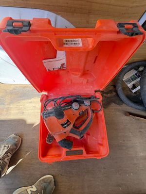 an orange tool box with a chainsaw inside of it