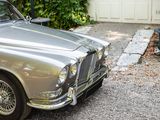 a silver car that is parked in the driveway