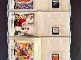 many video games in the plastic cases on the table