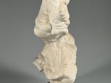 an image of a statue of a man holding a baby on a wooden base