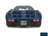 the back end of a blue sports car on a white background