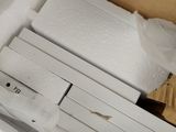 a cardboard box with a bunch of pieces of paper inside of it
