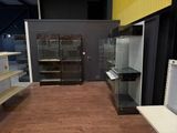 a glass display case in the middle of a room