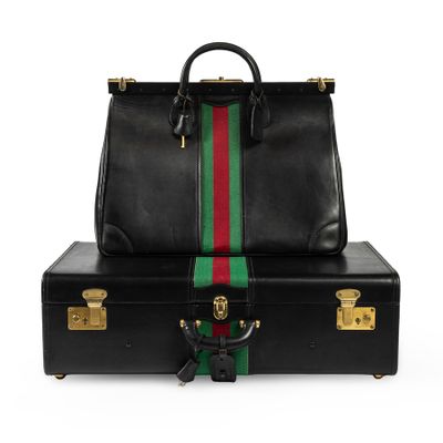 a black briefcase with a green and red stripe on the side