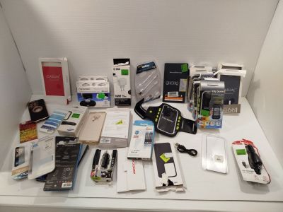 a lot of electronic items on a white table