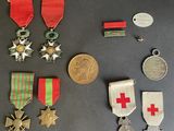 several medals and medals are displayed on a black surface