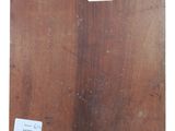 an image of a piece of wood with a tag on it
