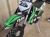 a dirt bike that is parked in a garage