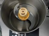 a metal bowl with a smiley face inside of it