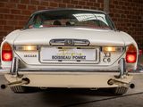an image of a white car parked in a garage