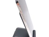 a cell phone that is sitting on top of a stand