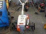 a small machine that is sitting in a garage