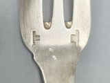 a fork that has a hole in the middle of it