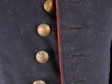 a close up of a military jacket with buttons on it