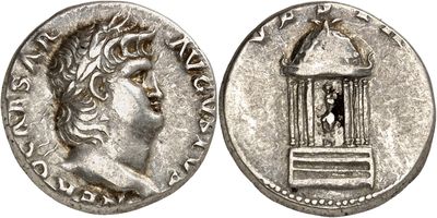 a silver coin with a bird in a cage on top of it