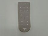 a remote control sitting on a table with a white background