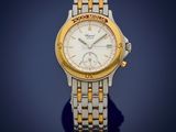 an image of a gold and silver watch on a blue background
