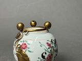 an image of a vase with a bird on it on a table