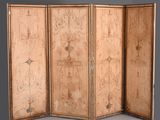 three paneled screen with drawings on the sides of each panel