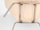 an image of a white chair with a leather seat and metal legs
