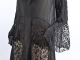 black lace dress with ruffles and bell sleeves on mannequin mannequin mannequin mannequin mannequin mannequin mannequin