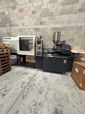 a machine that is sitting in a room with pallets