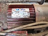 a red motor that is sitting on the ground