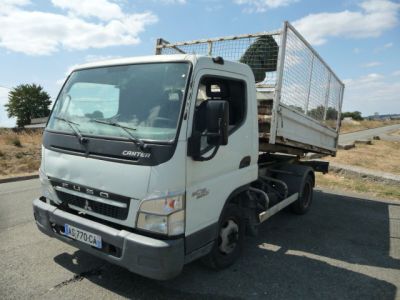 a white truck that is parked on the side of the road