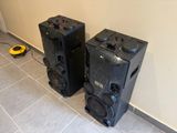 two speakers that are sitting next to each other on the floor