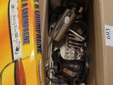 a cardboard box full of kitchen utensils and cookware