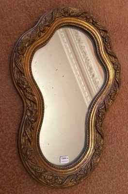 a mirror that is on the wall next to a wall