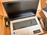 a laptop that is sitting in a box on the floor