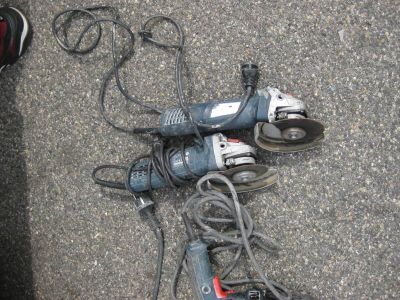 a corded drill and a corded cord on the ground