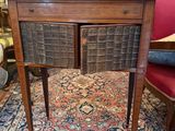 an old wooden desk with drawers and drawers on top of a rug