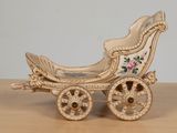 a miniature carriage that is sitting on a table