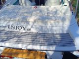 a boat that is sitting on the trailer in the yard