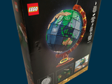 a box with a lego earth model inside of it
